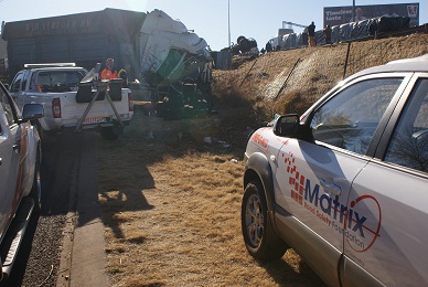 Coal trucks collide and roll down embankment in Edenvale